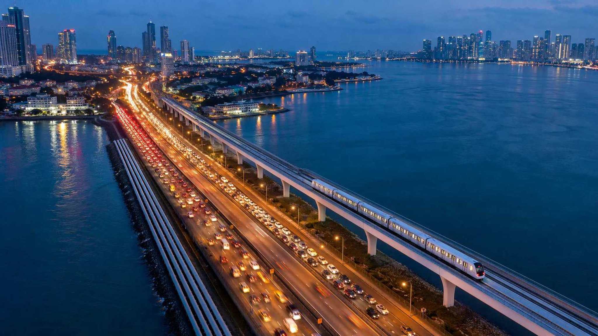 The Johor–Singapore Causeway at blue hour with the new RTS viaduct running alongside